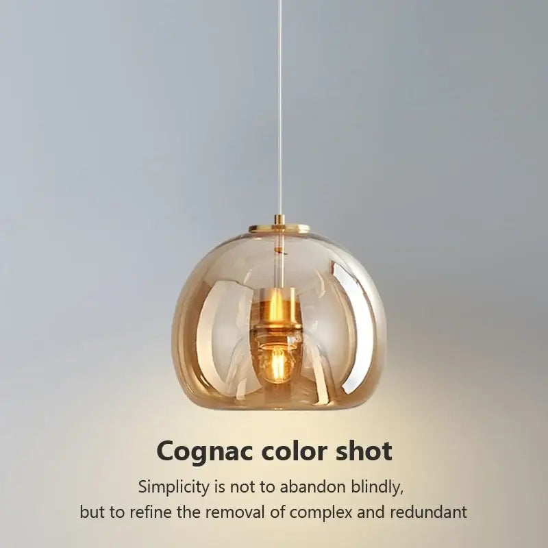 Decorbites led glass pendant light with a sleek spherical cognac glass globe and brass accents for modern nordic luxury