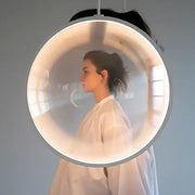 A sleek circular DecorBites led glass pendant light with translucent dome and metallic frame for hall or living room
