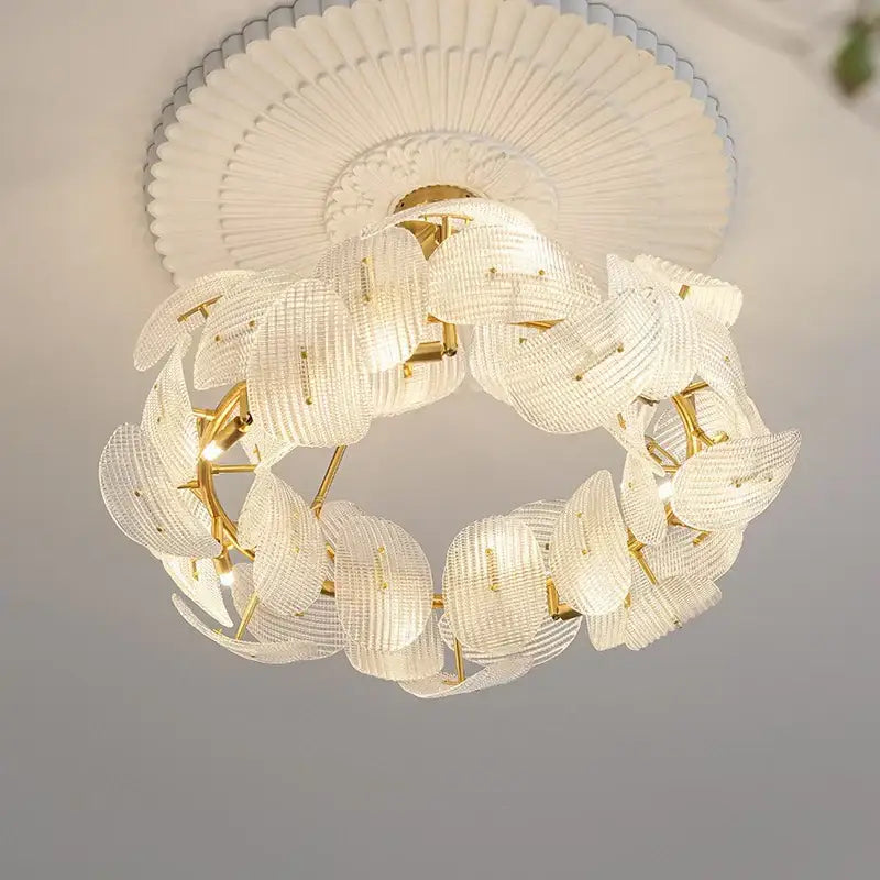 Elegant white crystal DecorBites led glass petal chandelier with gold-toned metal accents for dining table lighting
