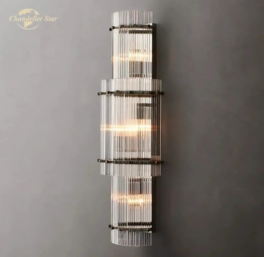 Modern decorbites led glass san marco wall lamp featuring stacked clear glass rods with dark metal bands emitting warm glow