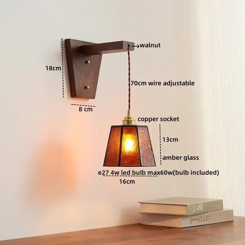 A warm amber glass pendant wall lamp with walnut bracket and copper socket from DecorBites LED glass sconce series