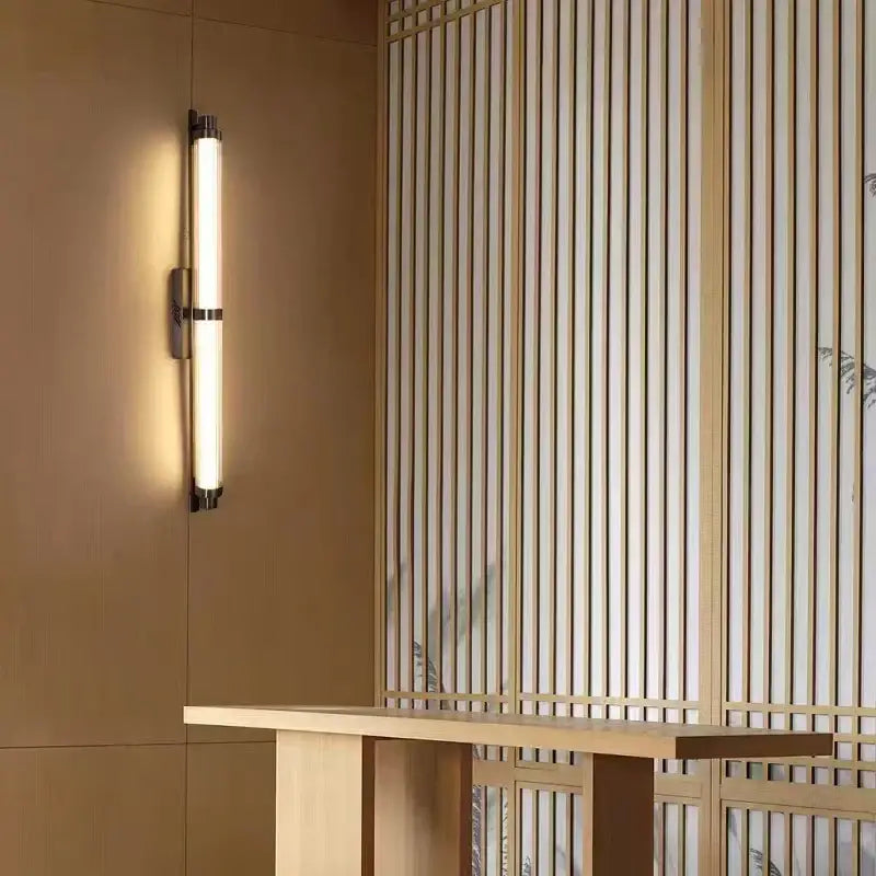 Modern minimalist DecorBites LED glass wall lamp with cylindrical frosted glass diffuser and matte black metal accents