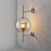 Modern DecorBites™ led glass wall lamp with clear globe, gold honeycomb mesh shade, and sleek metallic arms for bedroom decor