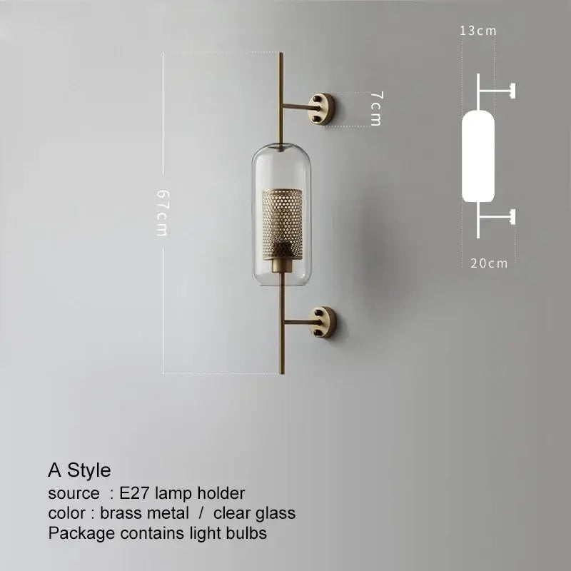 A sleek brass decorbites led glass wall lamp with clear glass cylinder and intricate mesh design for modern bedroom decor