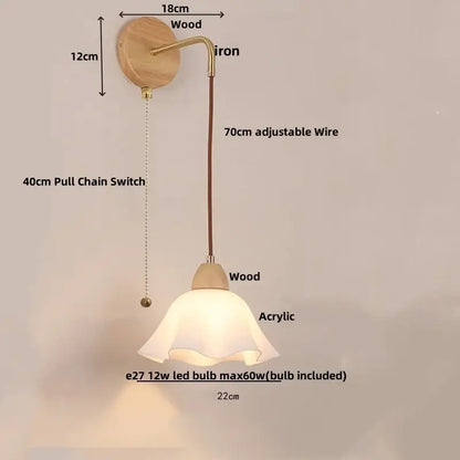 A warm-toned decorbites led glass wall lamp with wooden base brass iron arm acrylic shade for modern bedroom decor