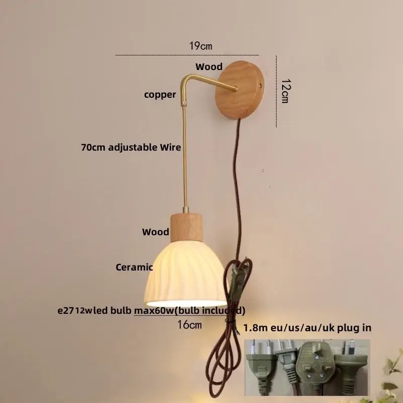 A warm-toned ceramic ribbed lampshade on an adjustable brass arm mounted on wood wall plate decorbites led glass wall lamp