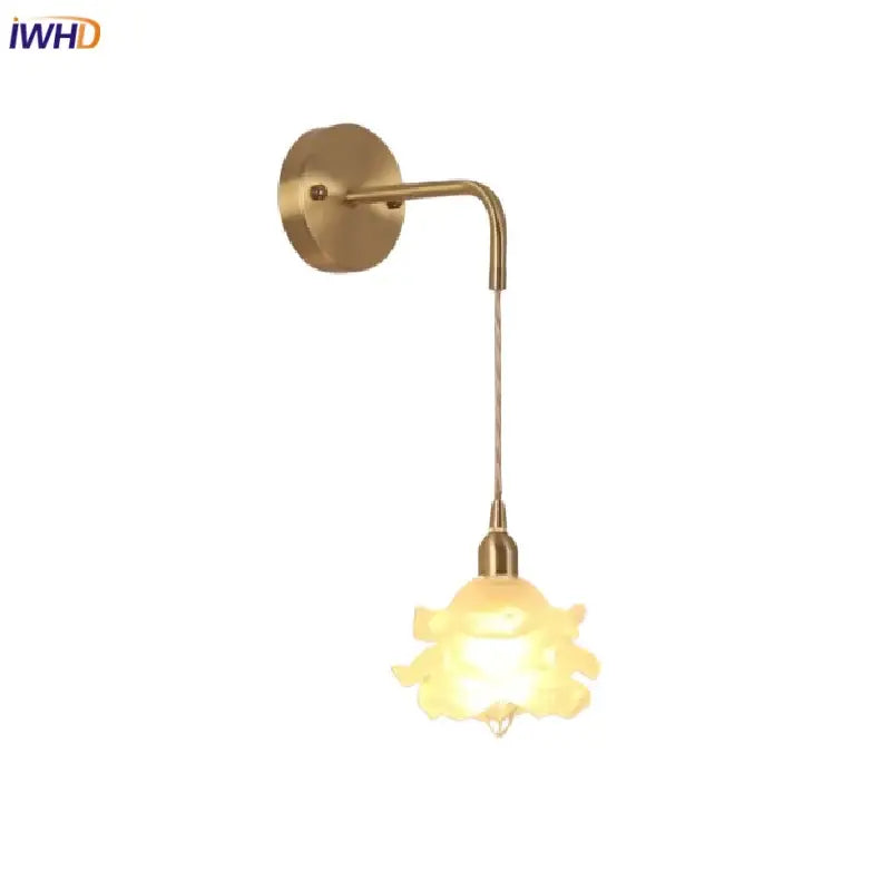 Gold-toned decorbites led glass wall lamp with curved arm and illuminated translucent flower-shaped shade for bedroom use