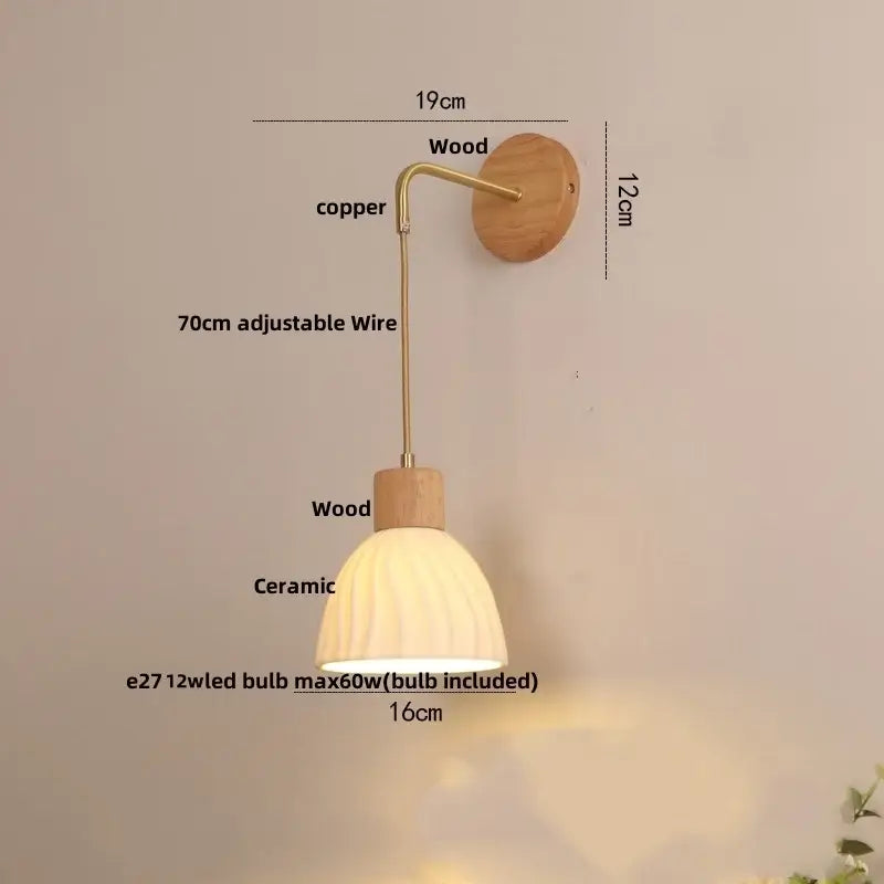 A warm-toned ceramic ribbed lampshade on an adjustable copper arm mounted on wood for decorbites led glass wall lamp