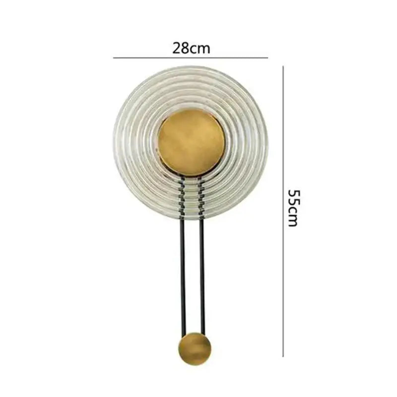 Modern wall lamp decorbites led glass features concentric clear glass rings brass disc and black metal rods design