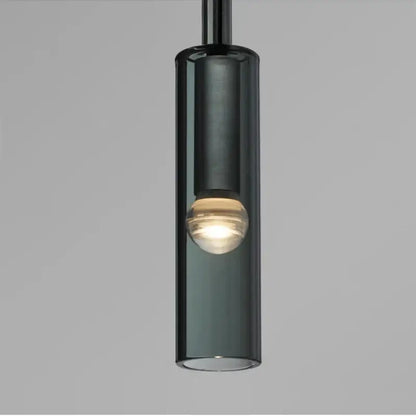 A sleek dark smoked glass decorbites led glass wall lamp with a warm bulb for modern indoor lighting