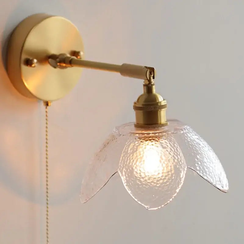Gold-toned DecorBites™ LED glass wall light fixture with textured clear flower-shaped shade for modern living rooms and bars