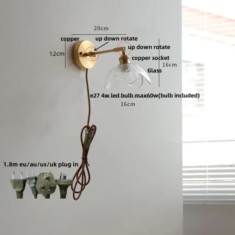 Copper wall light fixture with clear glass shade and adjustable up down rotation for modern living room or bar use