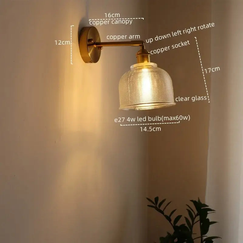 A warm-toned copper decorbites led glass wall light with clear textured glass shade for modern indoor spaces