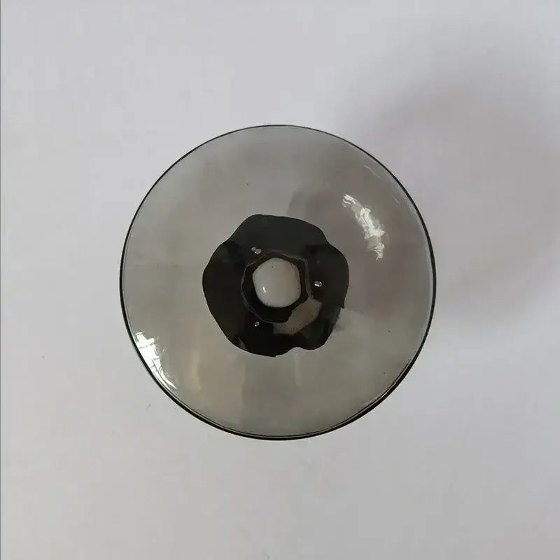 A sleek dark-tinted glass wine goblet with black rim and ornate stem detail for decorbites led glass wall sconce