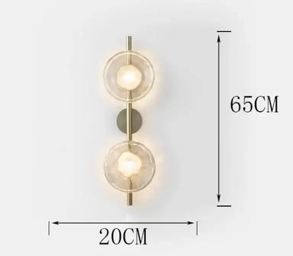 Modern brass-finished decorbites led glass wall sconce with two illuminated faceted globes for living room lighting