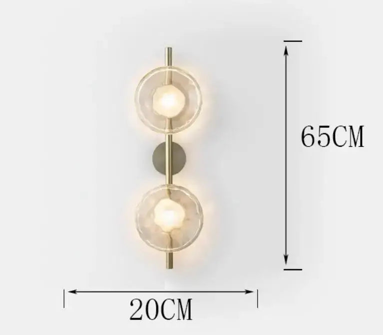 Modern brass-finished decorbites led glass wall sconce with two illuminated faceted globes for living room lighting