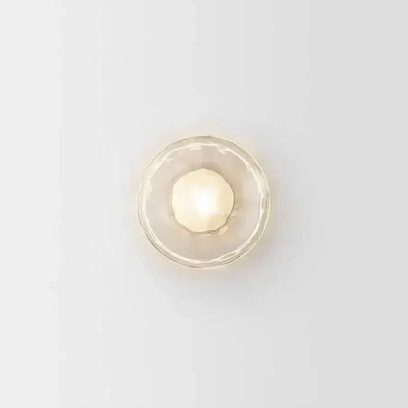 DecorBites led glass wall sconce with a frosted glowing bulb encased in clear textured glass for living room lighting