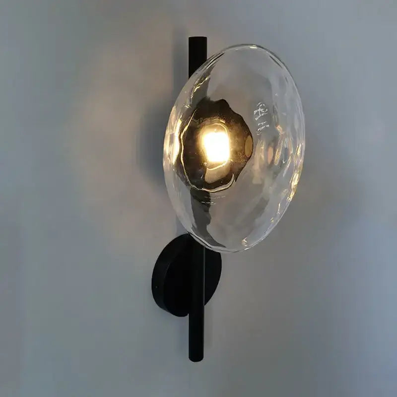 Modern black metal wall sconce with textured translucent glass globe for living room decorbites led glass wall lighting