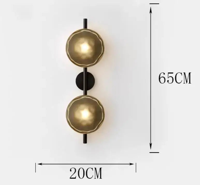 Gold-toned textured spherical wall sconce with black rod and plate decorbites led glass wall sconce for living room lighting