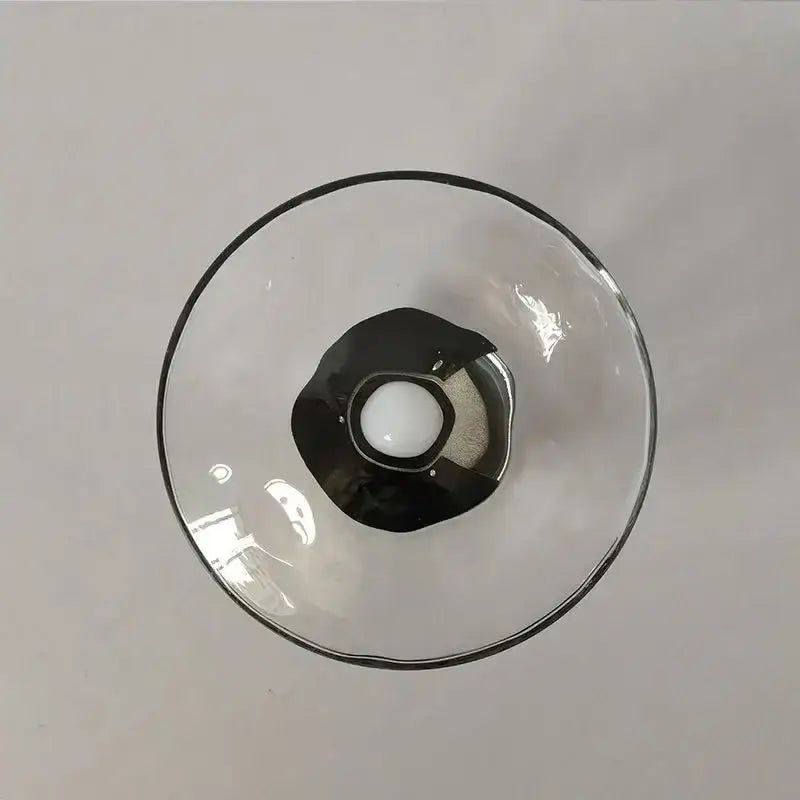Clear glass decorbites led glass wall sconce with black rim and base holding white sphere for living room lighting