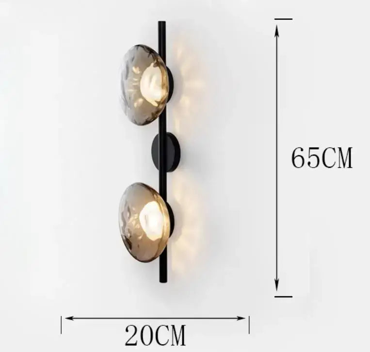 Black metal DecorBites led glass wall sconce with two amber-tinted textured globes for living room lighting