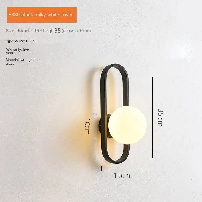 Black wrought iron wall sconce lamp with milky white glass globe for bedroom living room staircase by DecorBites