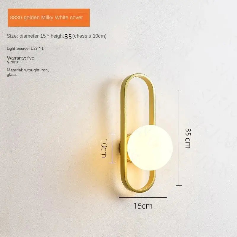 Gold-toned wrought iron decorbites™ led wall sconce lamp with milky white glass diffuser for bedroom and living room