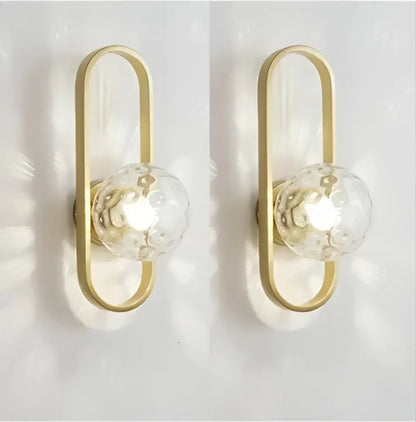 Gold-toned wall sconce lamp with clear faceted crystal globes for bedroom living room staircase by decorbites