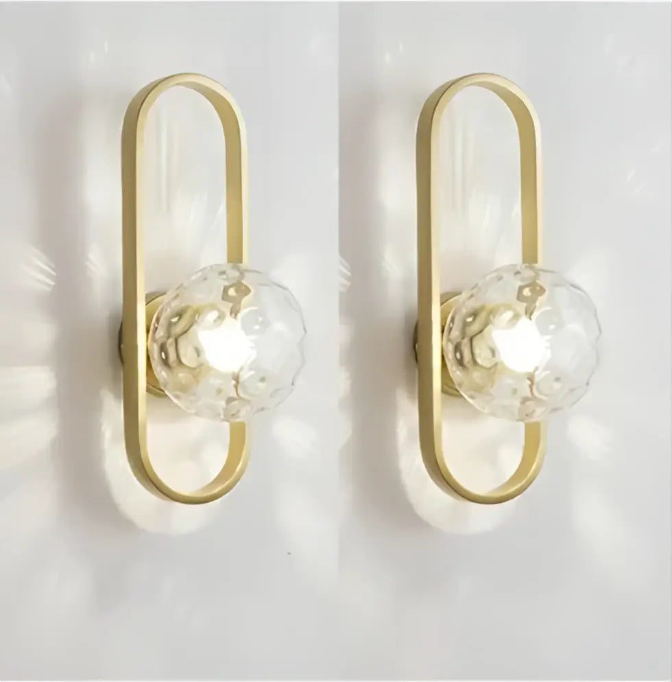 Gold-toned wall sconce lamp with clear faceted crystal globes for bedroom living room staircase by decorbites
