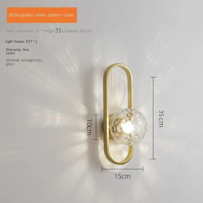 Golden decorbites™ led glass wall sconce lamp with elongated wrought iron frame and faceted globe for bedroom and living room