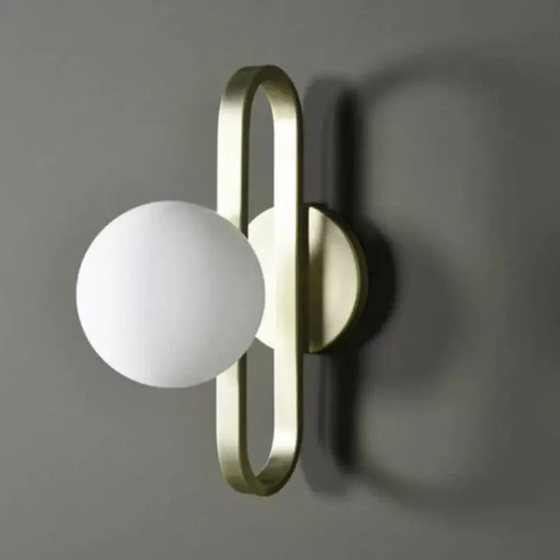 Modern brass-finished decorbites led glass wall sconce with frosted spherical shade for bathroom or hallway lighting
