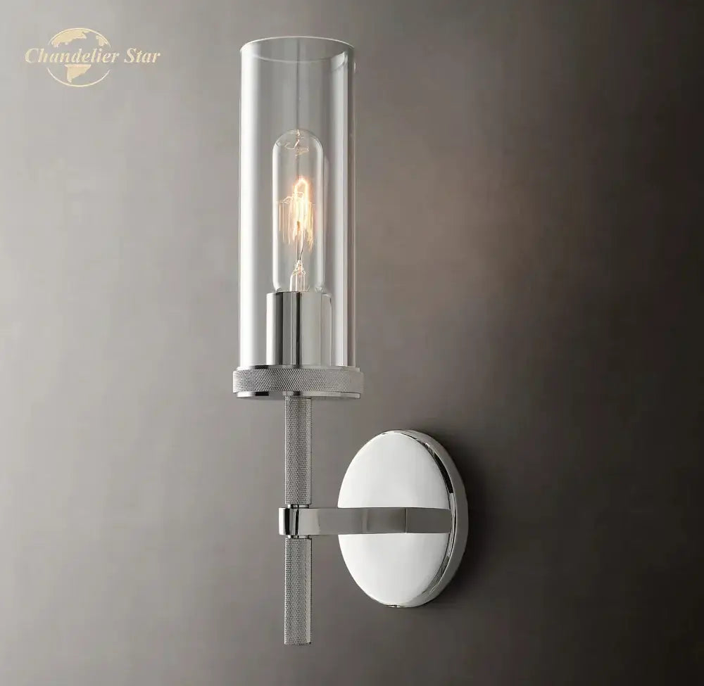 Chrome finished decorbites led glass wall sconce with clear glass cylinder and exposed filament bulb for indoor use