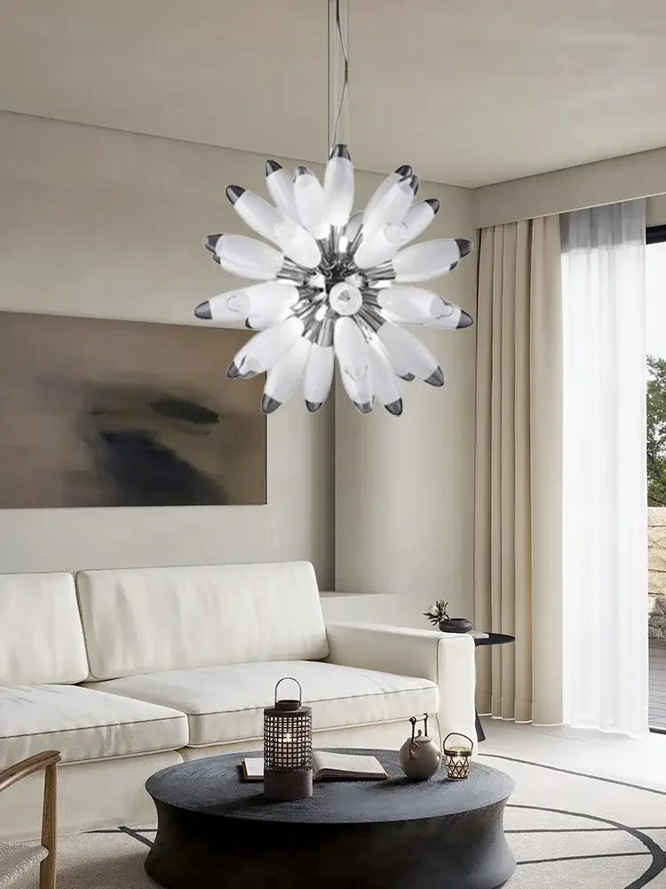 A modern decorbites led globe 2025 chandelier with white frosted glass petals in chrome and gold finish
