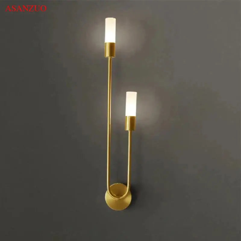 Gold-toned decorbites led candlestick wall light with frosted glass shades and curved metal frame for indoor decor