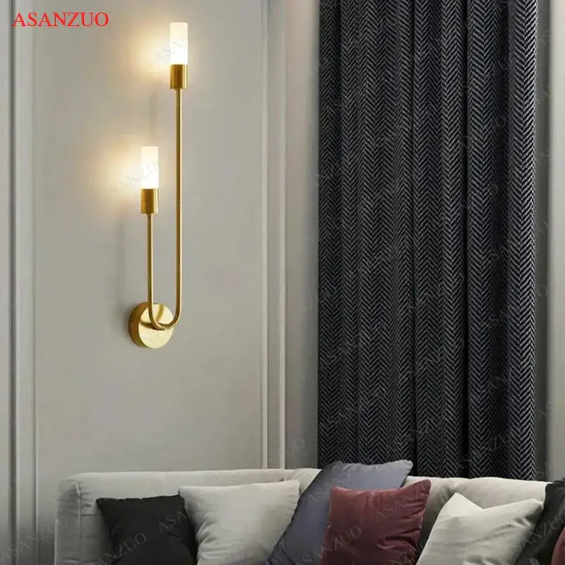 Gold-toned DecorBites LED candlestick wall light with two vertical frosted glass shades for indoor ambiance