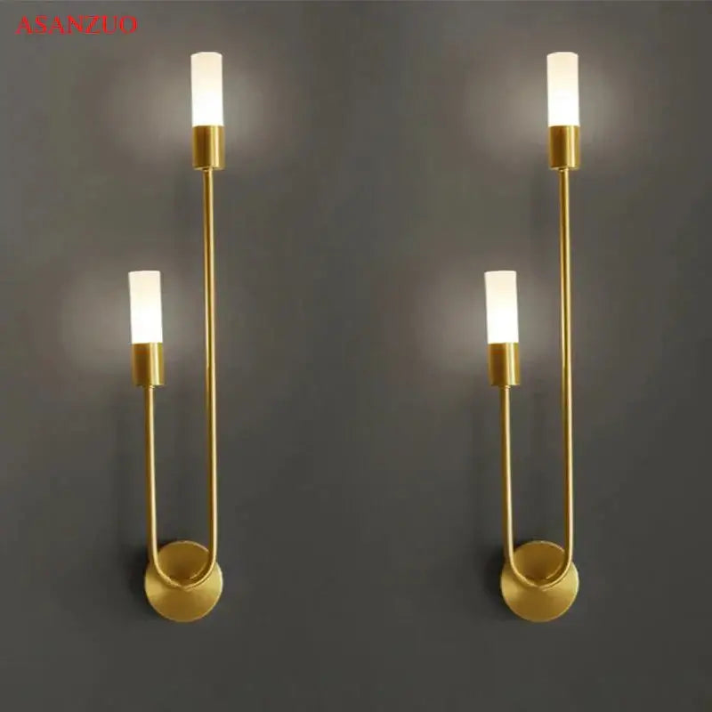 Gold-toned decorbites led candlestick wall light with minimalist curved metal arms and frosted glass shades for indoor decor