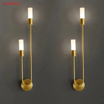Gold-toned decorbites led candlestick wall light with minimalist curved metal arms and frosted glass shades for indoor decor