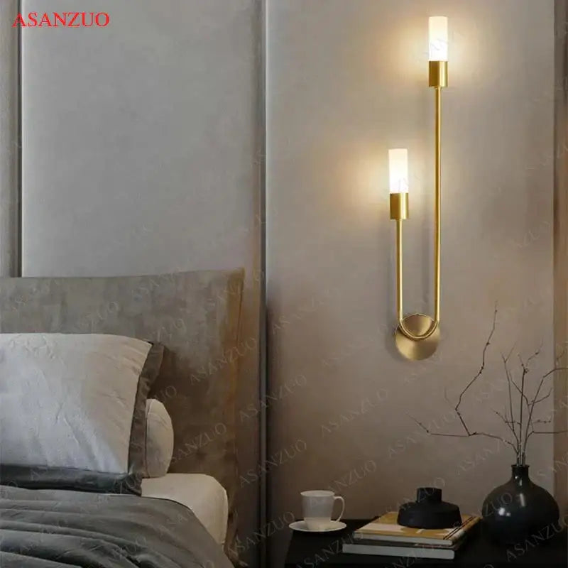 Gold-toned decorbites led candlestick wall light with two vertical cylindrical fixtures for indoor ambiance decor