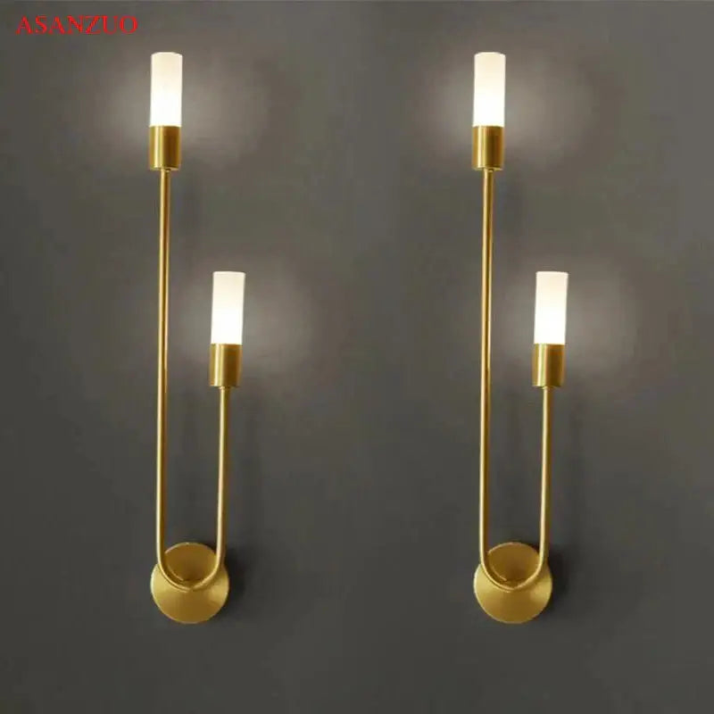 Gold-toned decorbites led candlestick wall light with minimalist curved metal arms and frosted glass bulbs for indoor decor