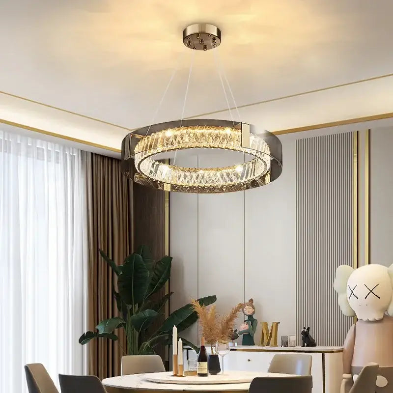Modern circular decorbites led gold crystal glass chandelier with sleek metallic frame and warm ambient light for living spaces