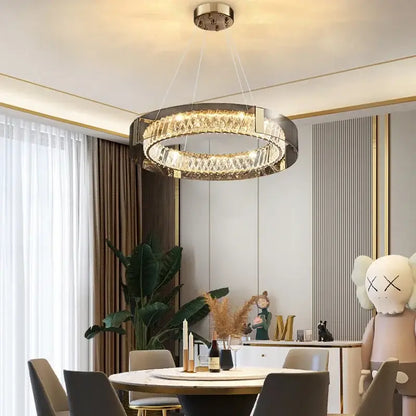 Modern circular DecorBites LED gold crystal glass chandelier with sleek metallic frame and sparkling crystal accents