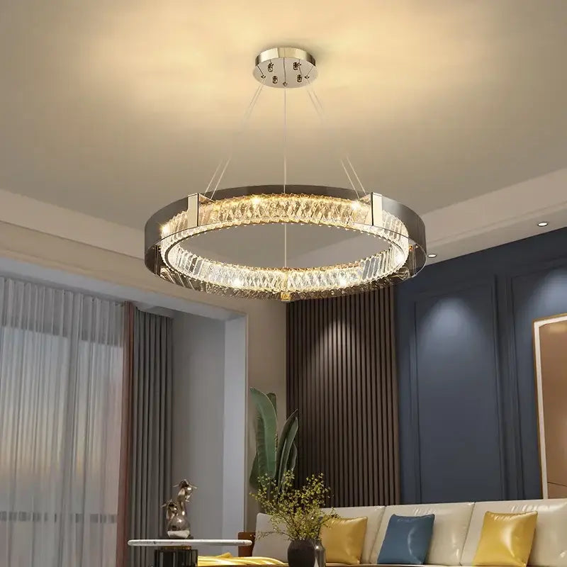 Modern circular decorbites led gold chandelier with sleek metallic frame and cascading gold crystal glass elements for living room