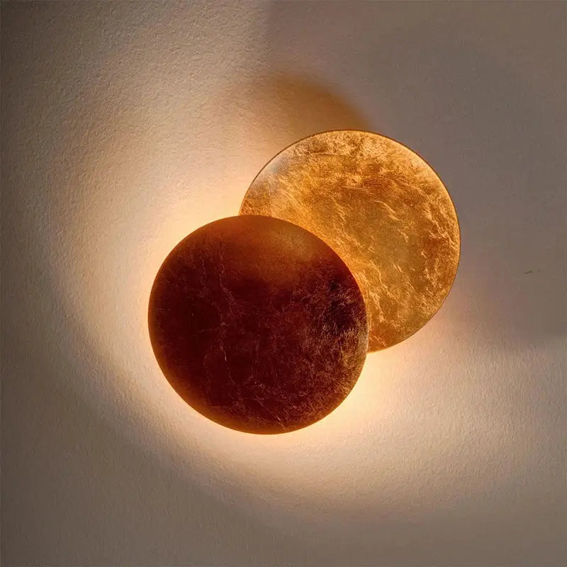 DecorBites led gold eclipse wall lamp with warm-toned amber glass textured circular design for bedroom and living room