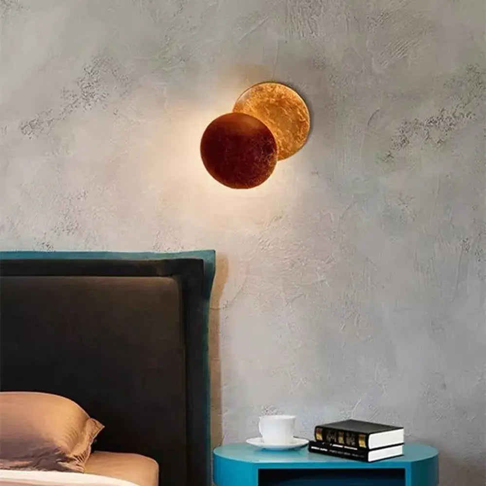 Golden and copper-toned spherical decorbites led gold eclipse wall lamp with textured matte finish for bedroom living room