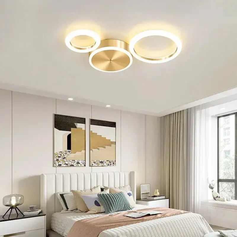 Modern gold-toned circular DecorBites LED gold ring chandelier with three concentric rings for living room lighting