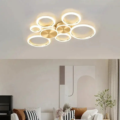 Modern gold-toned circular decorbites led gold ring chandelier with glowing led rings for living and dining rooms