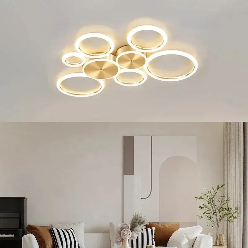 Modern gold-toned circular decorbites led gold ring chandelier with glowing led rings for living and dining rooms