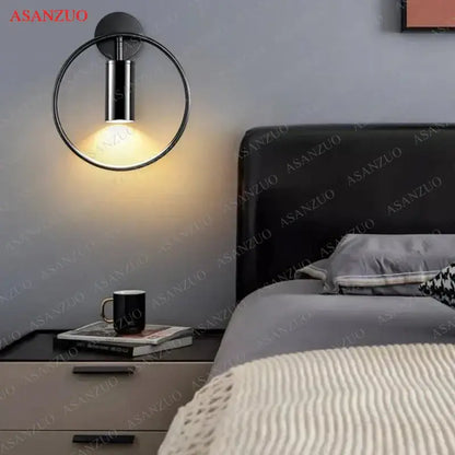 Black circular wall lamp with sleek metallic finish and warm ambient light from DecorBites led gold round ring design