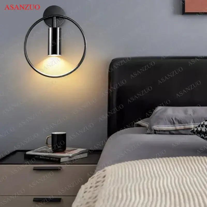 Black circular wall lamp with sleek metallic finish and warm ambient light from DecorBites led gold round ring design