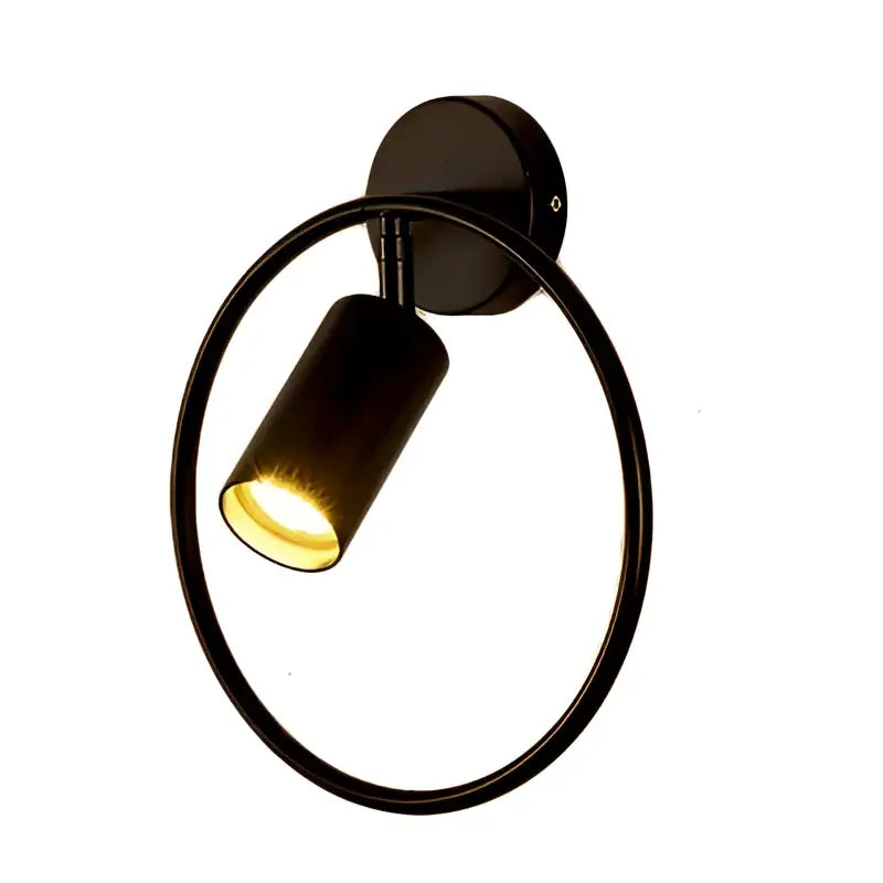 Black circular wall lamp with sleek modern design and warm yellow light in decorbites led gold round bedroom sconce